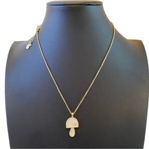 Mother of Pearl Mushroom Gold Toned Pendant w/ Solitary Pave Crystal.